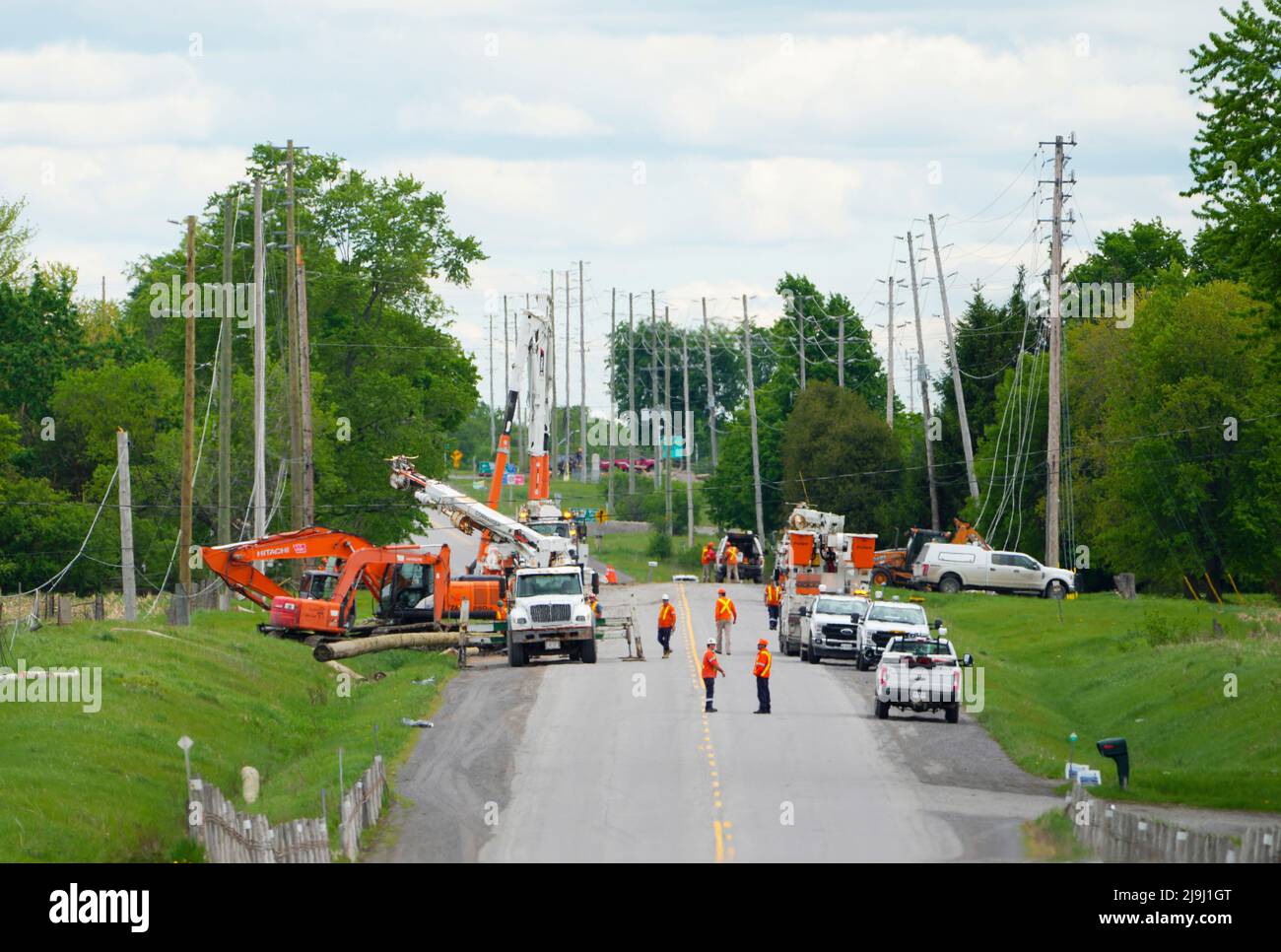 Hydro Crews work to fix broken power poles and restore power in the ...