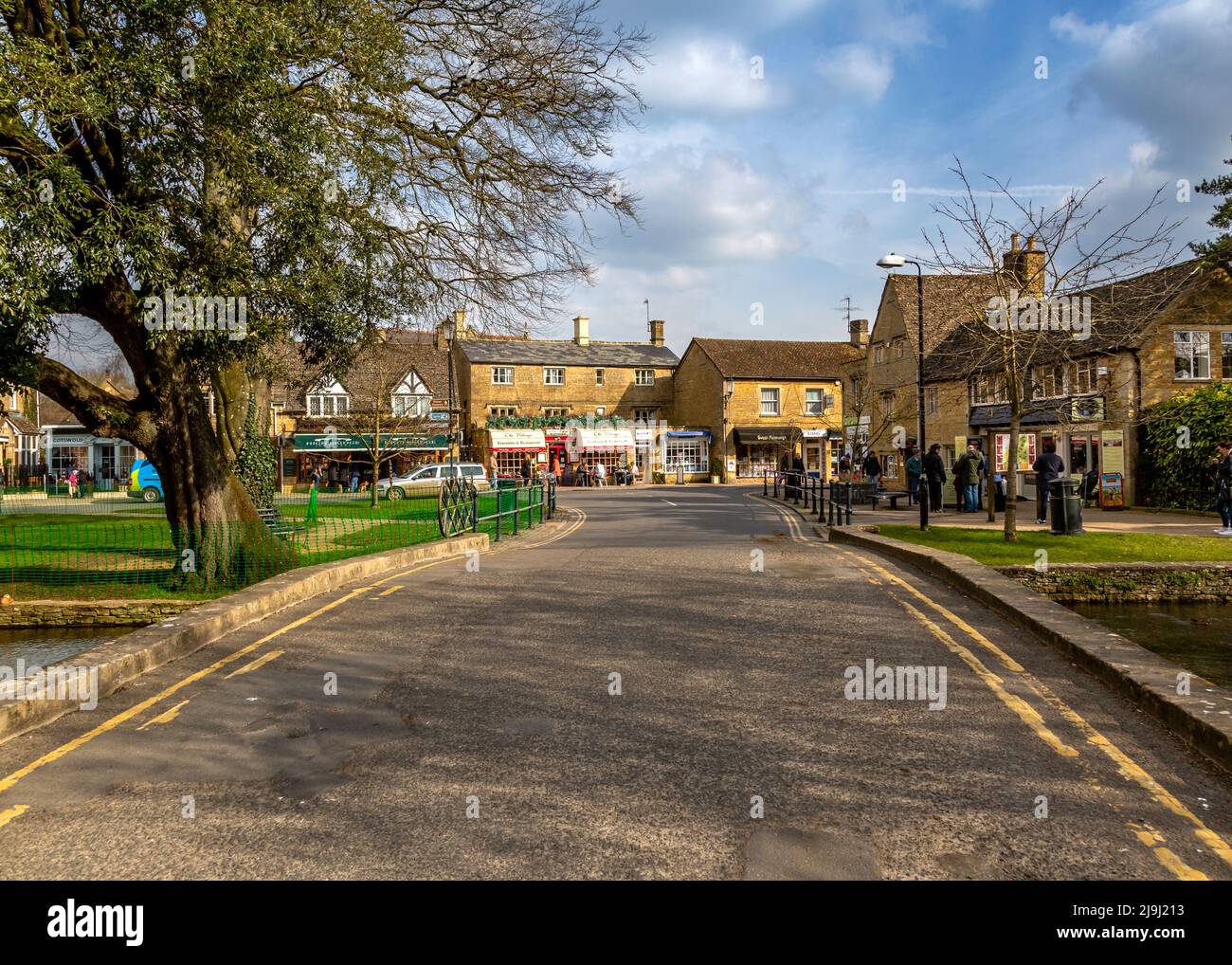 Riverside street in Bourton On The Water, Gloucestershire, England
