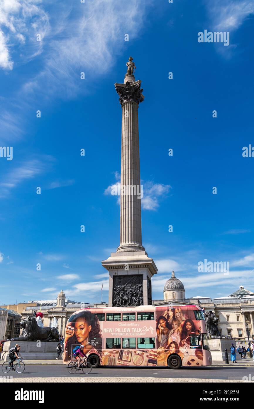 London, England - May 13, 2022: Nelson's Column at Trafalgar Square and double-decker bus, London, Great Britain Stock Photo