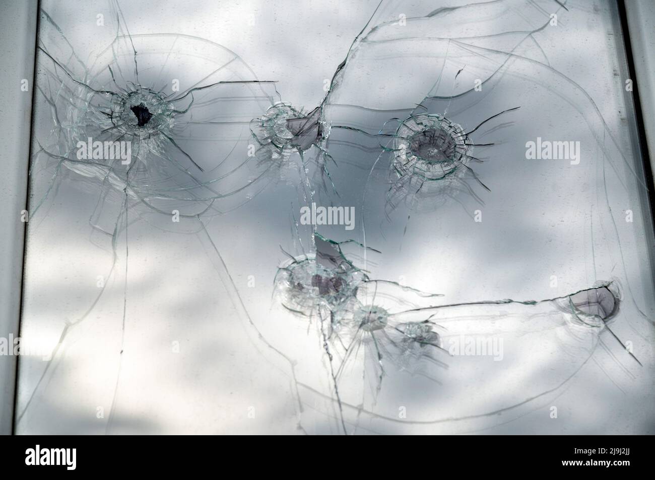 Consequences of mortar shelling by soldiers of the Armed Forces of Ukraine of the border village of Tetkino, Glushkovsky district, Kursk region. Bullet holes in a building window. 20.05.2022 Russia, Kursk region Photo credit: Oleg Kharseev/Kommersant/Sipa USA Stock Photo