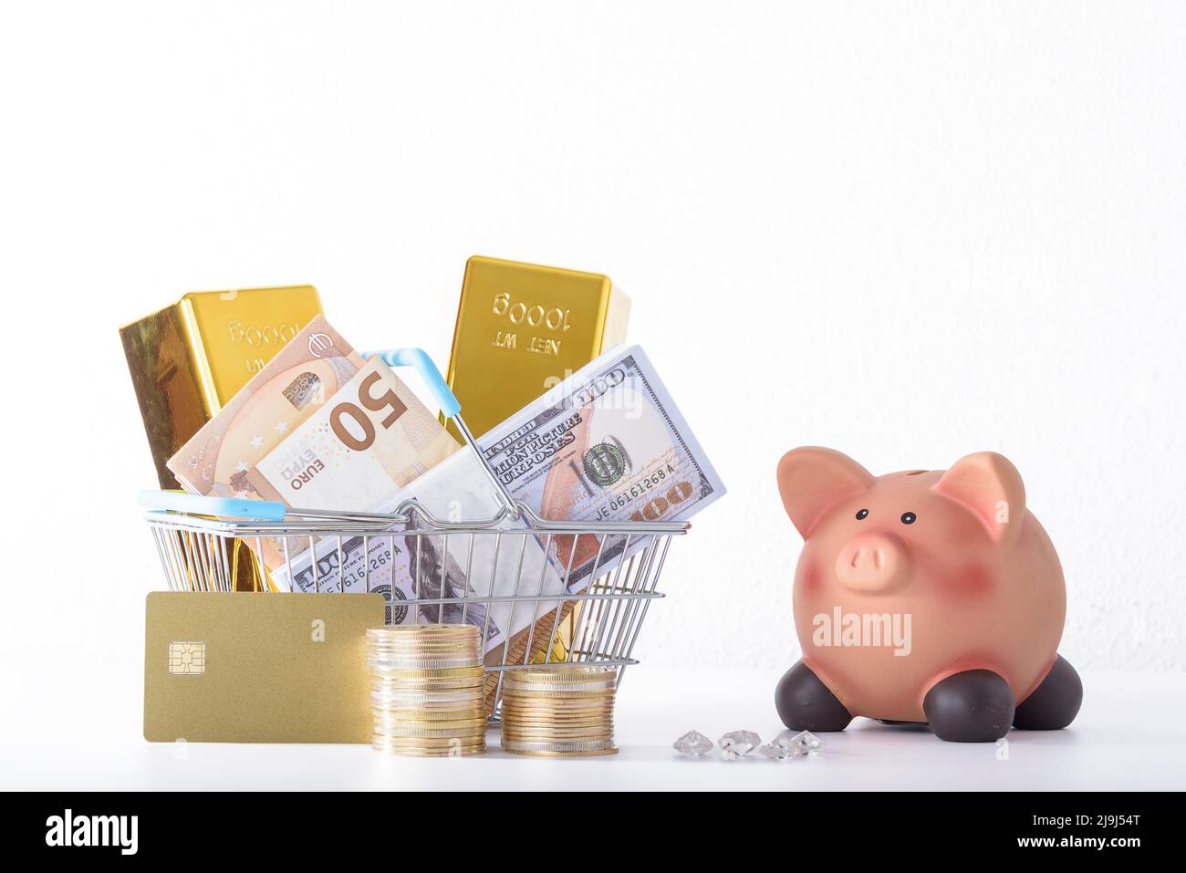 Piggy bank full of money. Coins and dollar bills. A symbol of accumulation and well-being. Purchase planning. Financial literacy. Stock Photo