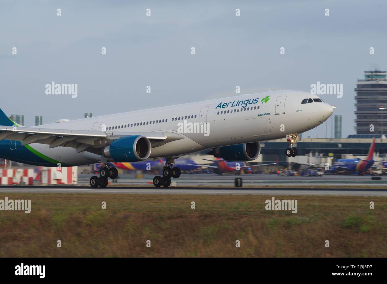 Image of Aer Lingus Airbus A330-300 with registration EI-EIN shown touching down at Los Angeles International Airport, LAX. Stock Photo