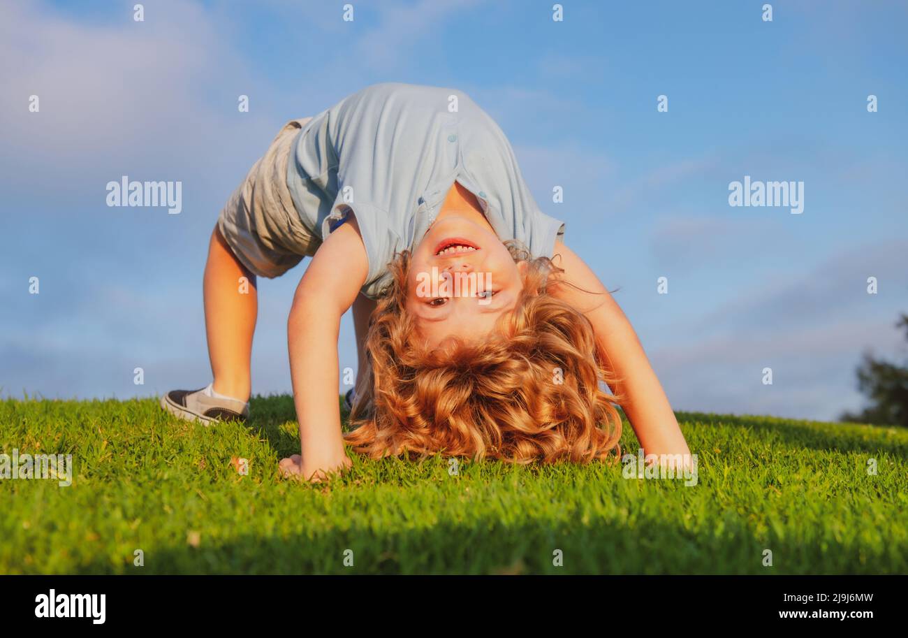 Kid girl standing upside down hi-res stock photography and images - Alamy