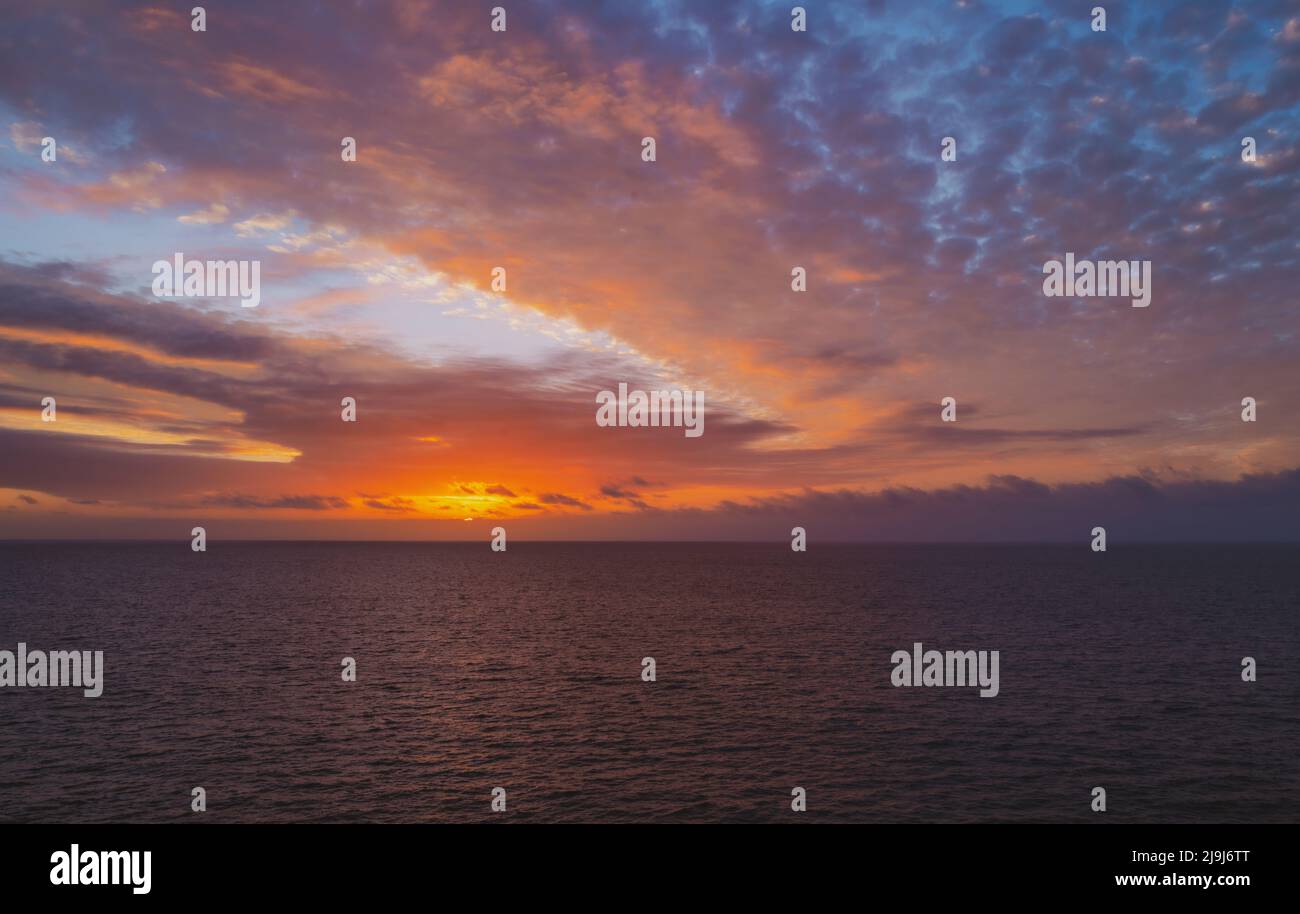 Sunset in the sea with beautiful clouds. Sunrise ocean seascape Stock ...