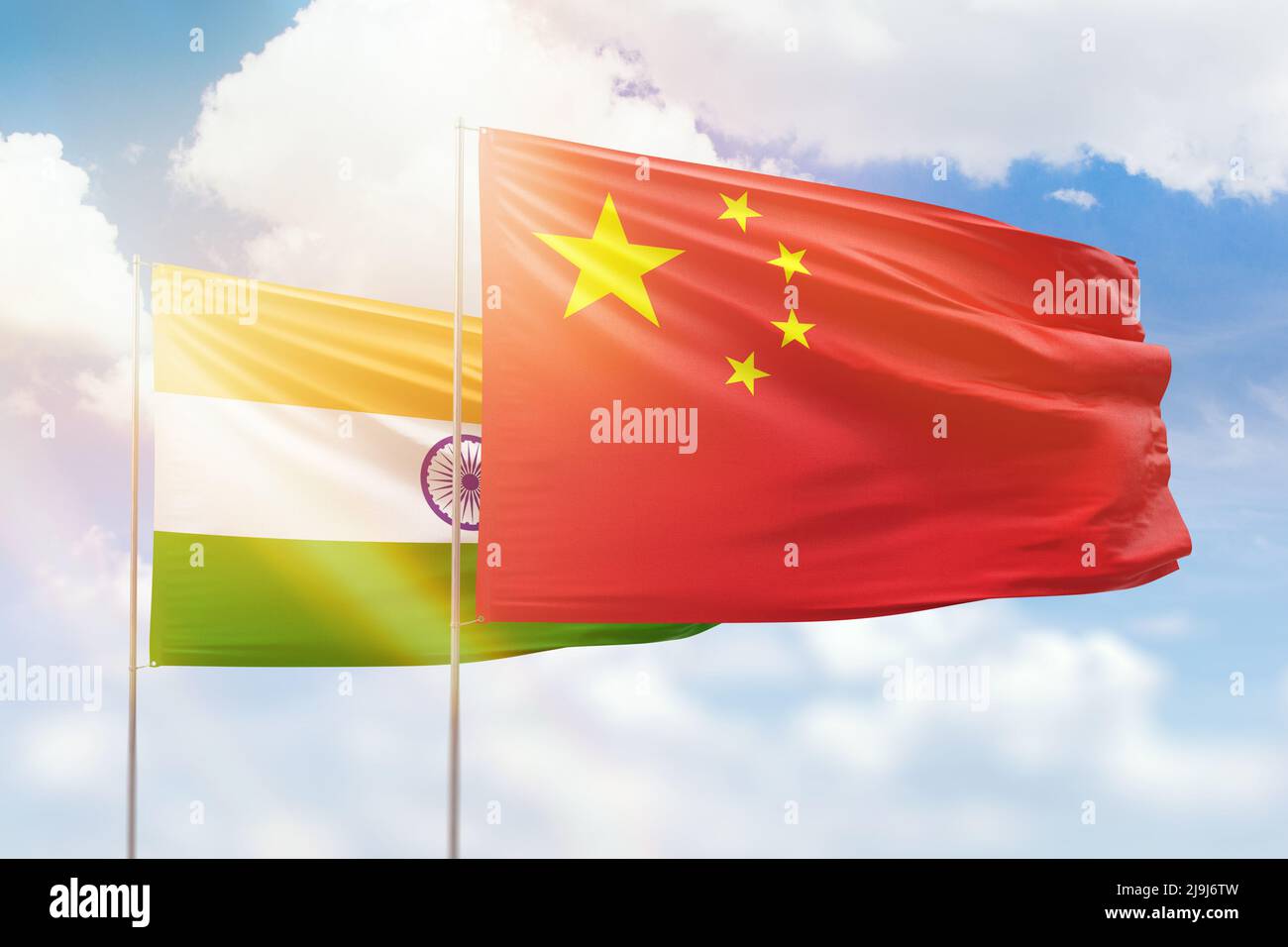Sunny blue sky and flags of china and india Stock Photo