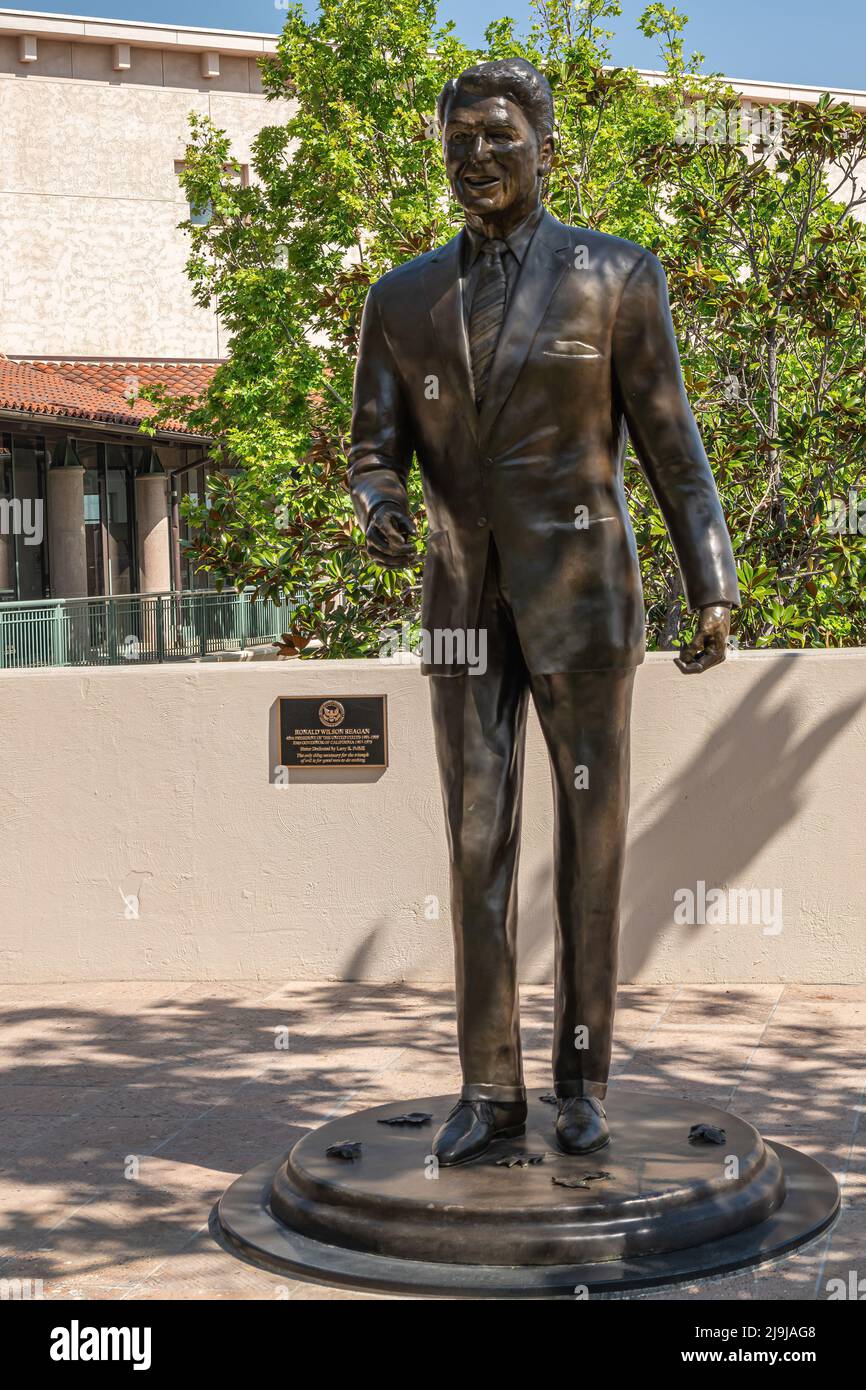Simi Valley, California, USA - April 27, 2022: Ronald Reagan Presidential Library. Frontal closeup of Lifesize bronze statue at entrance to his librar Stock Photo