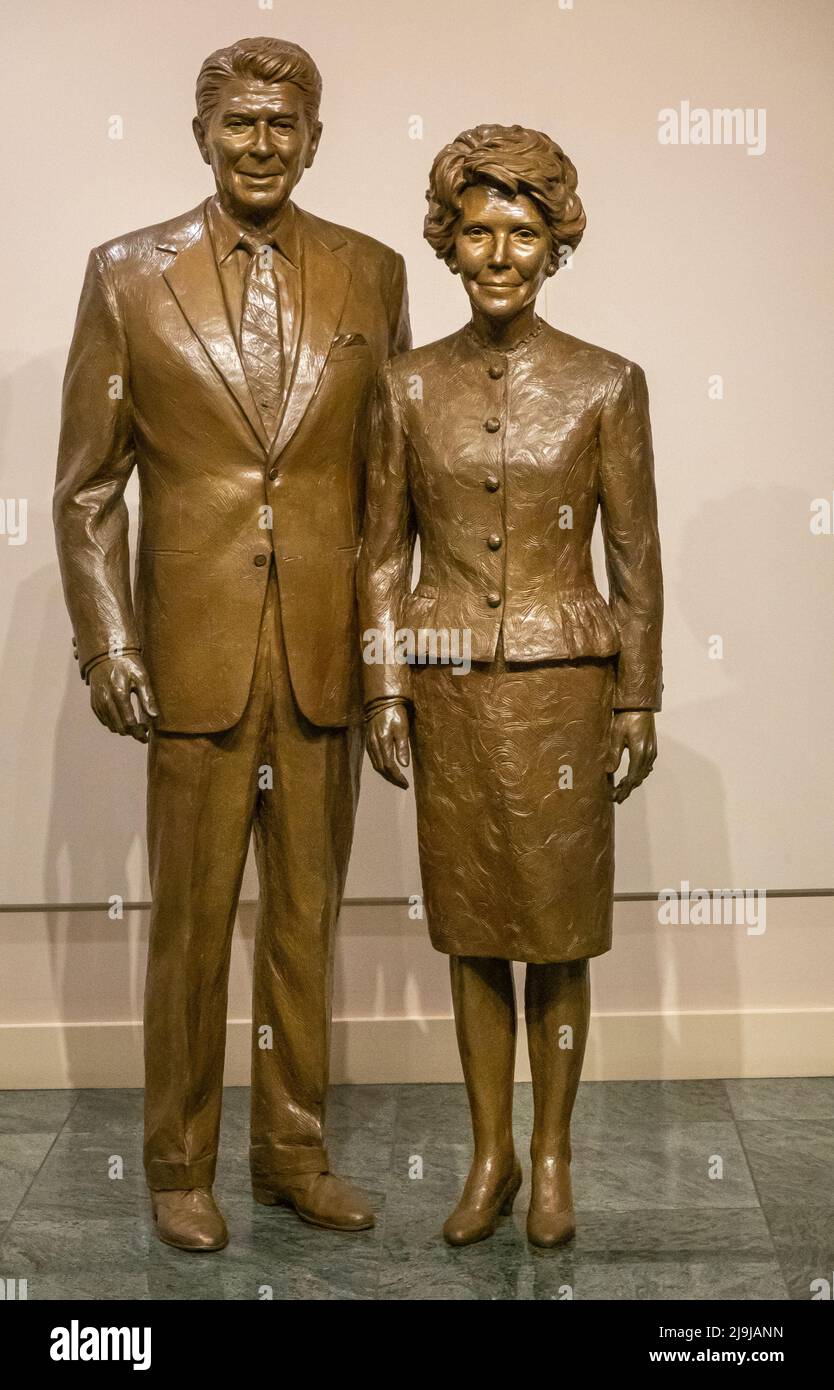 Simi Valley, California, USA - April 27, 2022: Ronald Reagan Presidential Library. Brown lifesize statues, shoulder to shoulder, of the President and Stock Photo