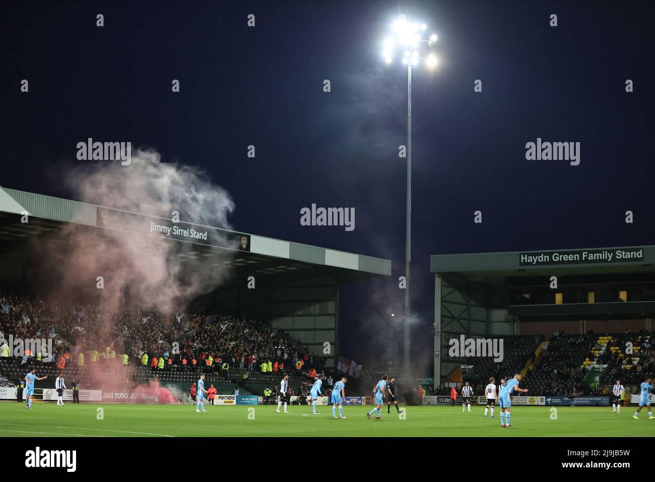 NOTTINGHAM, ENGLAND. MAY 23RD 2022. Flares are thrown onto the edge of the pitch after Grimsby score during the Vanarama National League Play-Off match between Notts County and Grimsby Town at Meadow Lane, Nottingham. (Credit: James Holyoak/Alamy Live News) Stock Photo