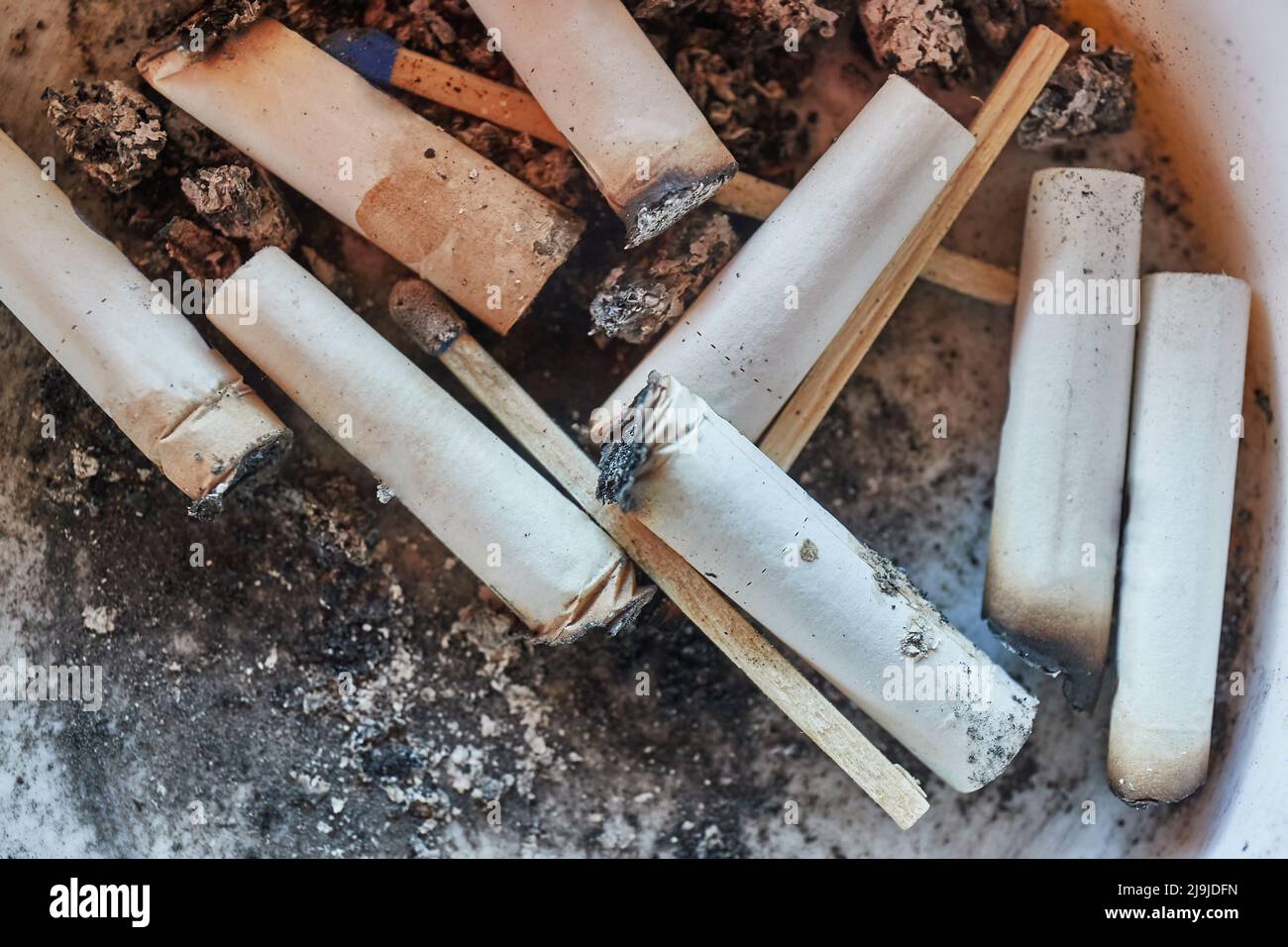 Cigarette buts in an ashtray Stock Photo