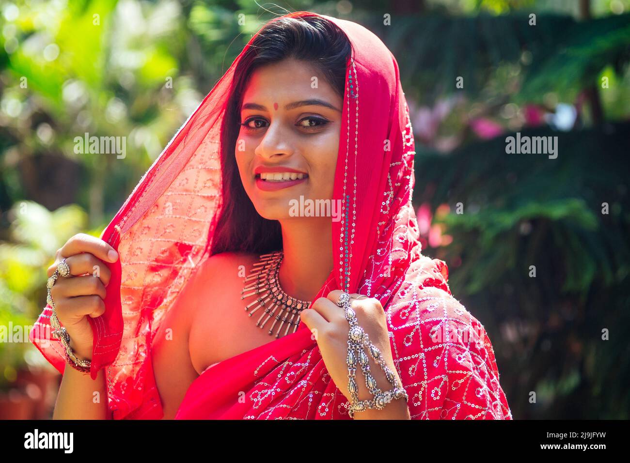 portrait of attractive indian female model in vacation on paradise