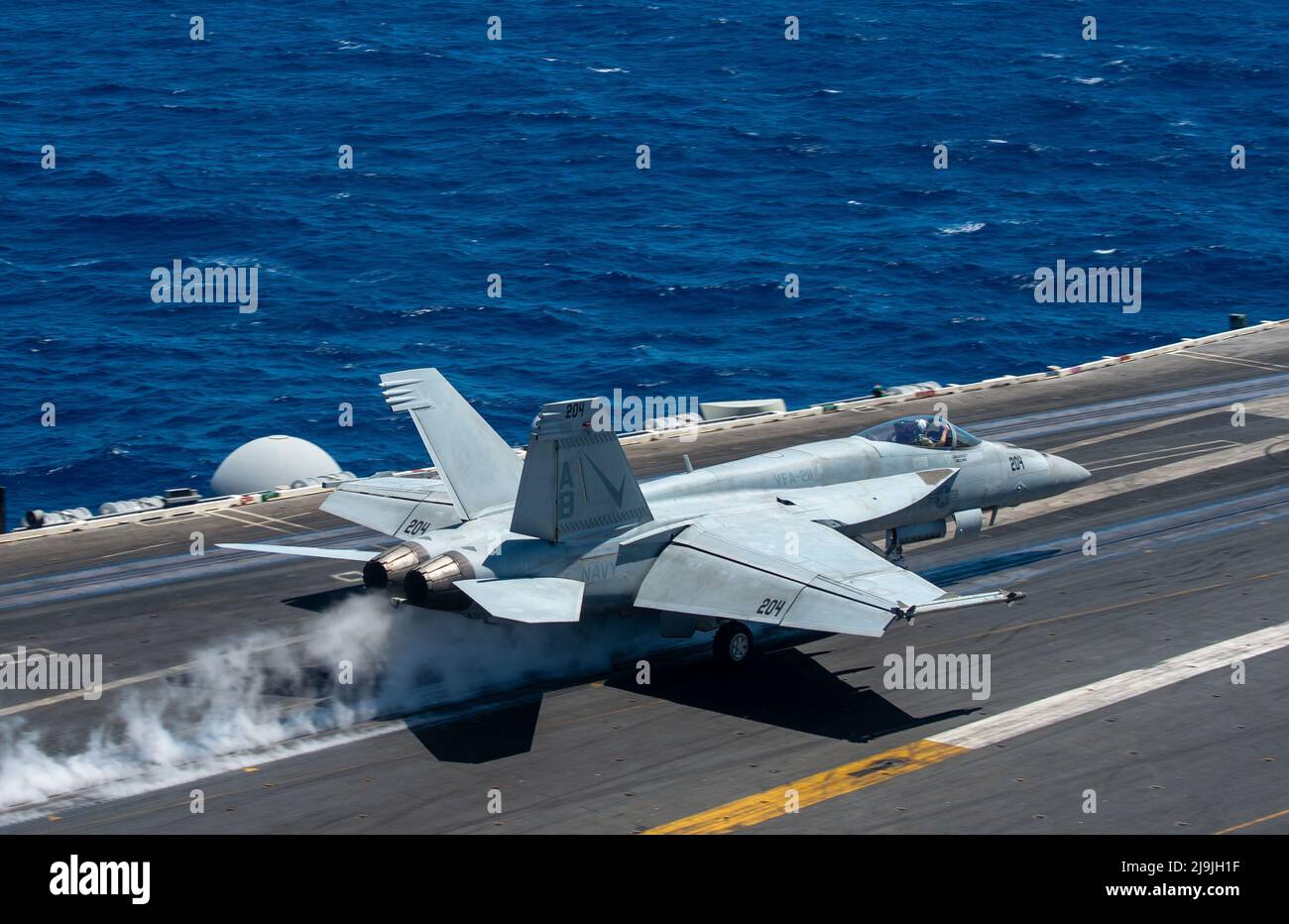 220520-N-BP862-1088 MEDITERRANEAN SEA (May 20, 2022) An F/A-18E Super Hornet, attached to the “Fighting Checkmates” of Strike Fighter Squadron (VFA) 211, launches from the flight deck of the Nimitz-class aircraft carrier USS Harry S. Truman (CVN 75) in support of Mare Aperto 22-1/Italian MINEX 22, May 20, 2022. Mare Aperto 22-1/Italian MINEX 22 is a joint and combined high end exercise sponsored by the Italian navy aimed at strengthening and enhancing the combat readiness of participating forces in maritime and amphibious operations. (U.S. Navy photo by Mass Communication Specialist 3rd Class Stock Photo