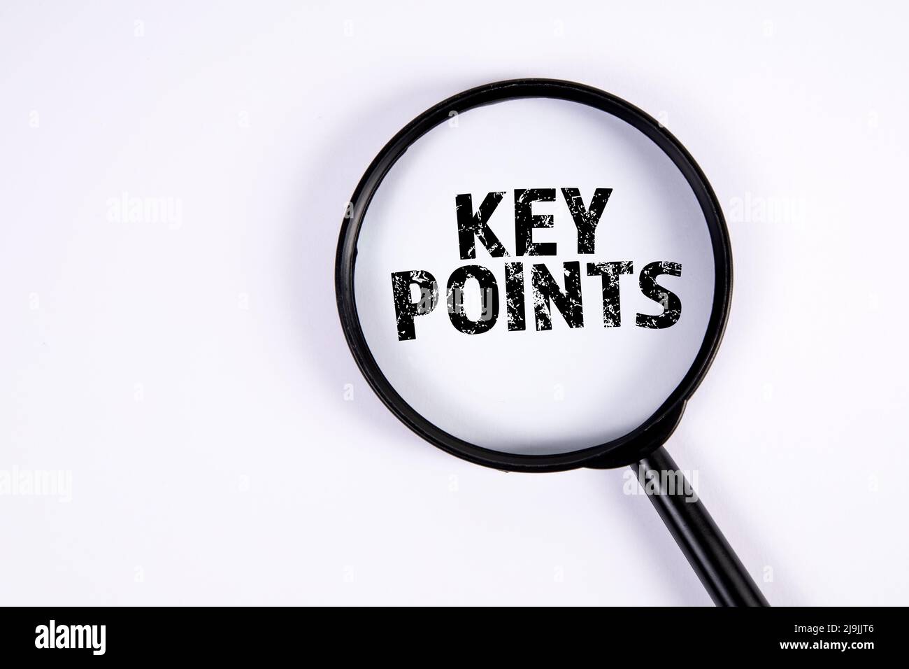 KEY POINTS. Text and magnifying glass on a white background. Stock Photo