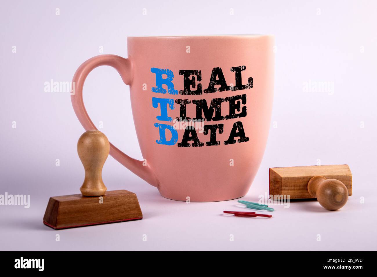 RTD REAL TIME DATA concept. Coffee cup with text on a white background. Stock Photo