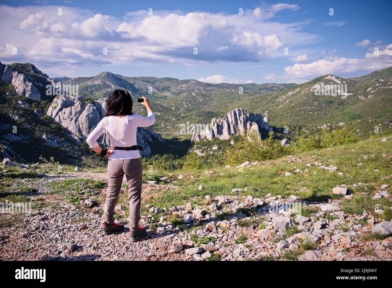 Woman hiker taking photos hi-res stock photography and images - Alamy