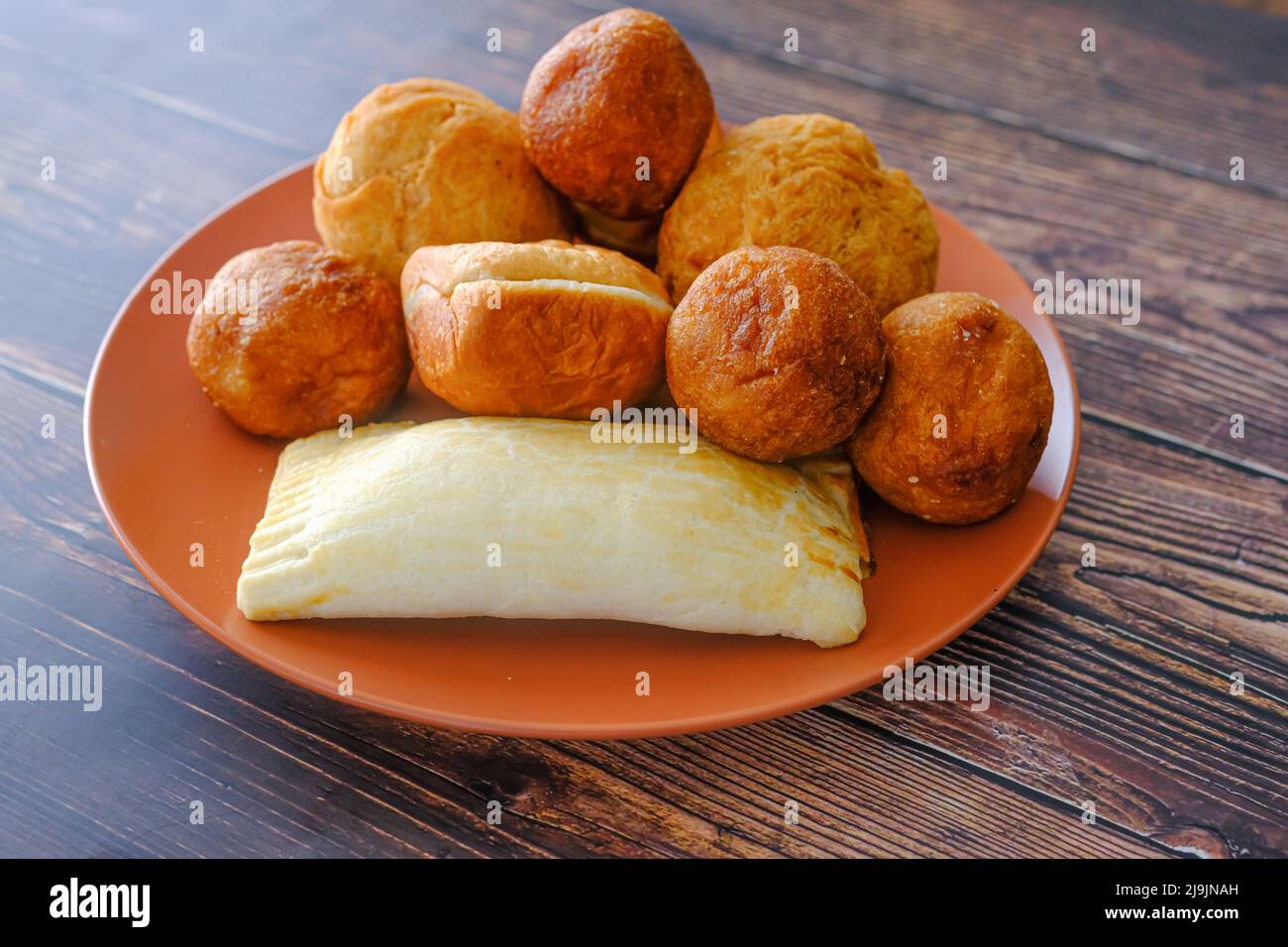 Nigerian Snacks Meat Pie, Puff Puff , buns and Egg roll Stock Photo Alamy