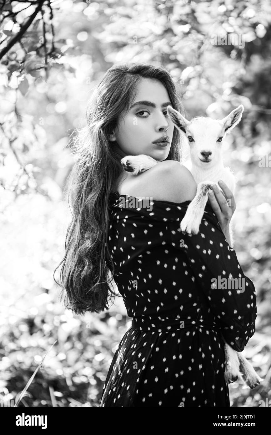 pretty virgins model Natural young woman. Virgin girl in village hold yeanling. Sprinf fashion  portrait of beautiful woman holding a small lamb Stock Photo - Alamy