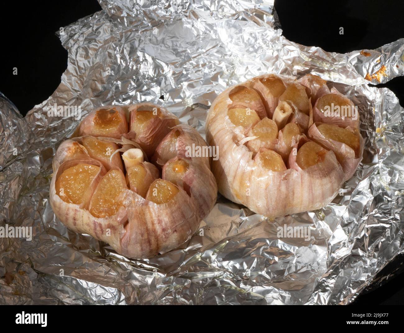 Two whole heads garlic right out of the oven. Golden roasted garlic