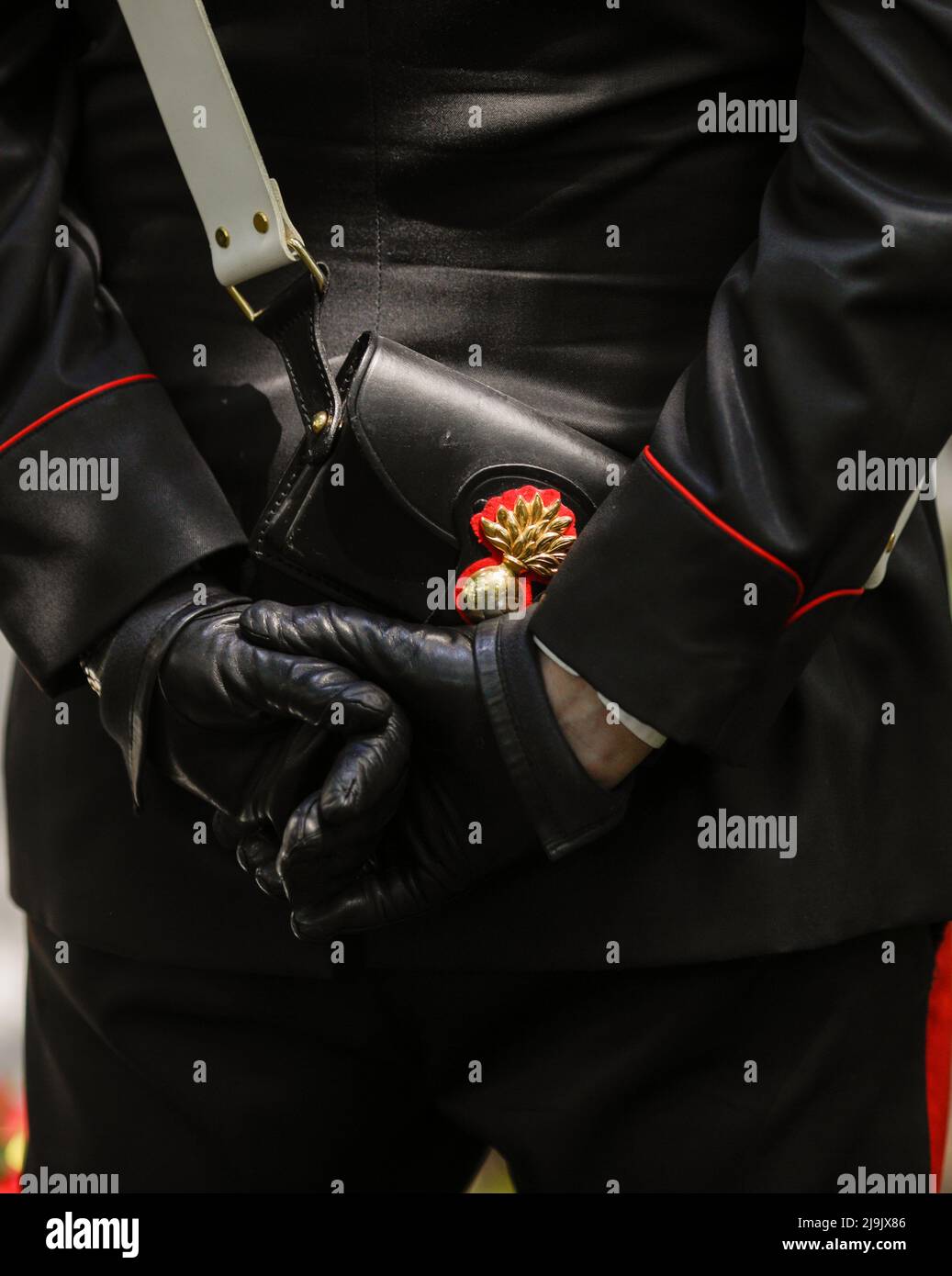 Bucharest, Romania - May 23, 2022: Details with the uniform and leather handbag, with a carabinier's cap badge, of an Italian policeman in a ceremonia Stock Photo