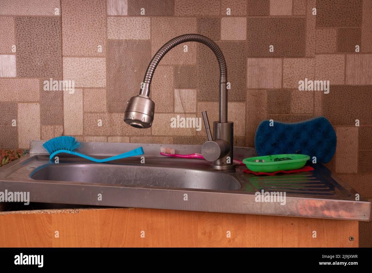 Soviet apartment, kitchen sink in the kitchen, broken bedside table, kitchen sink and faucet