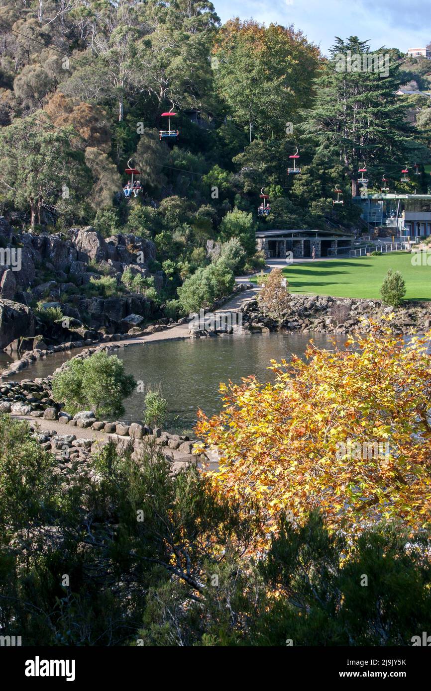 A chairlift crosses above the First Basin in the Cataract Gorge at Launceston in Tasmania, Australia. Stock Photo