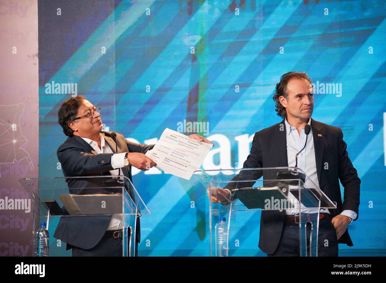 Presidential candidate Gustavo Petro for the political alliance 'Pacto Historico' (Left) shows back the document given by candidate Sergio Fajardo and Federico 'FICO' Gutierrez (Right) reacts during the last televised Presidential debate ahead of Colombia's presidential elections that will take place on May 29, in Bogota, Colombia, May 23, 2022. Photo by: Chepa Beltran/Long Visual Press Stock Photo