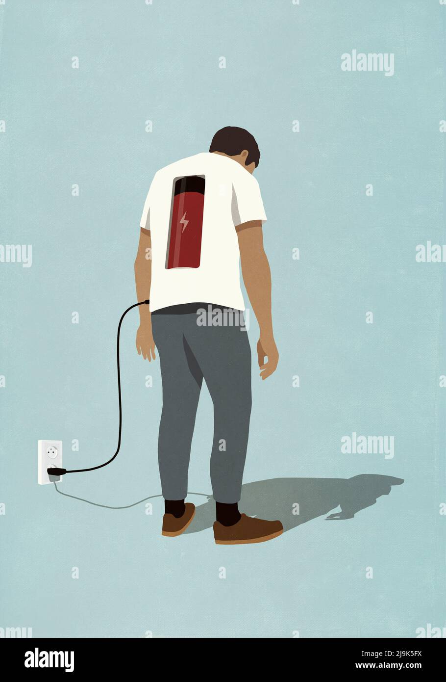 Man charging battery in back with plug, standing at electric outlet