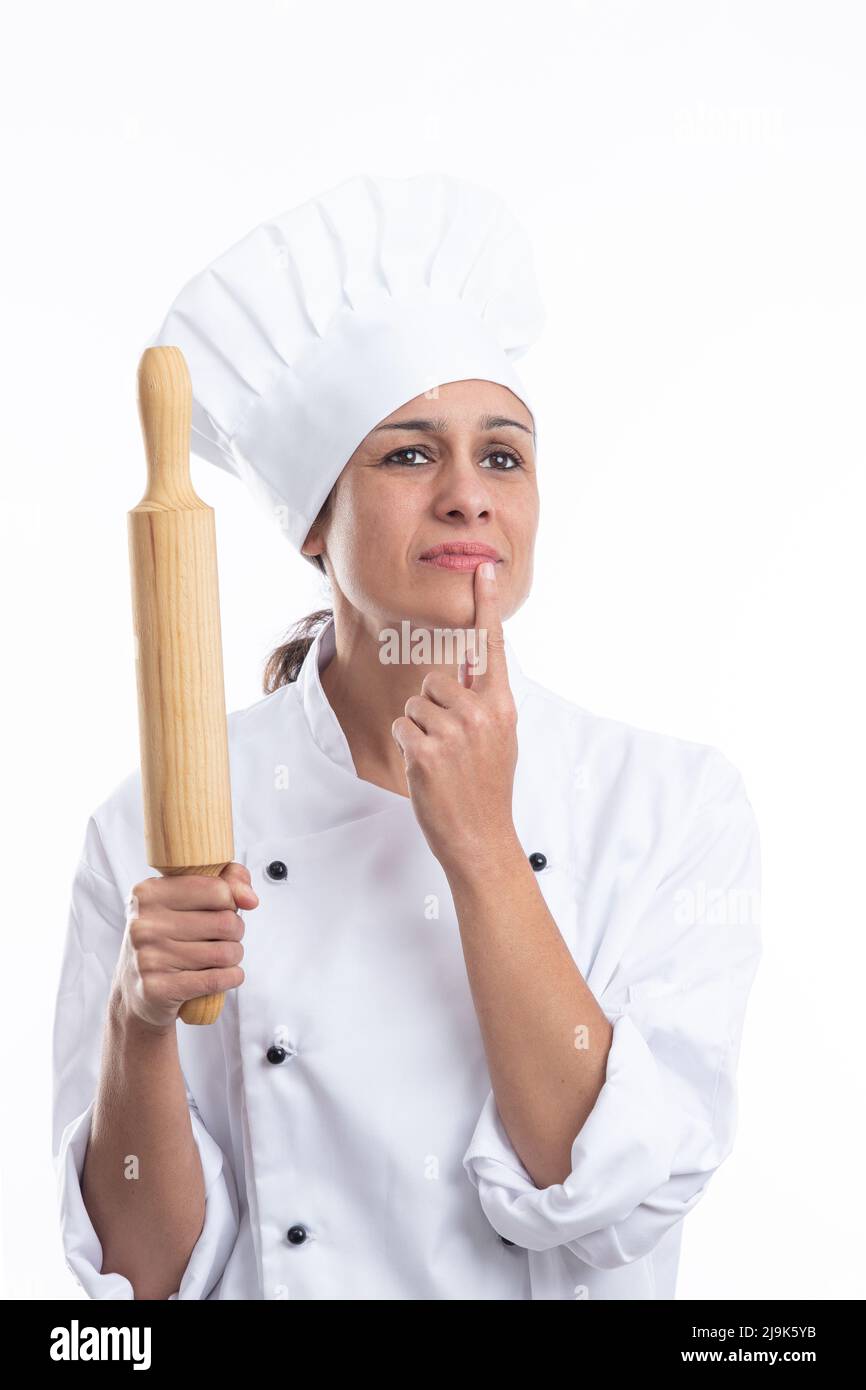 Portrait of young Caucasian chef thinking what dish she will make now ...