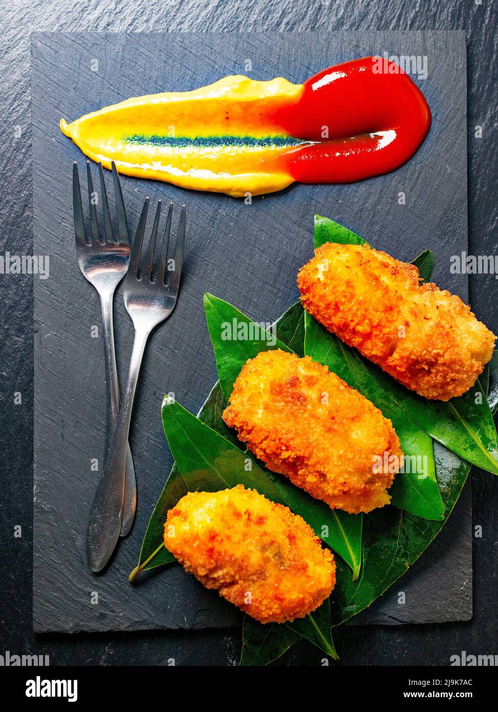 A view of an appetizer plate of croquettes served in a gourmet style Stock Photo
