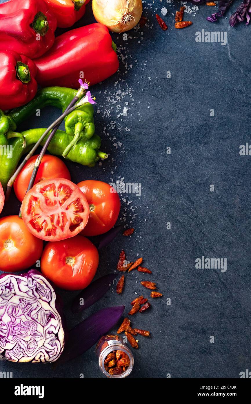 Healthy foods. Vegetables and fruits collection on black cement or stone background. Top view and copy space. Stock Photo