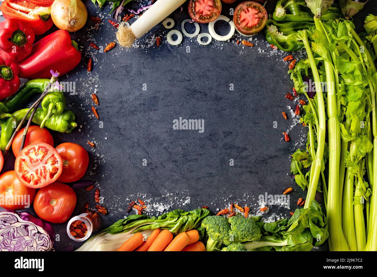 Healthy foods. Vegetables and fruits collection on black cement or stone background. Top view and copy space. Stock Photo