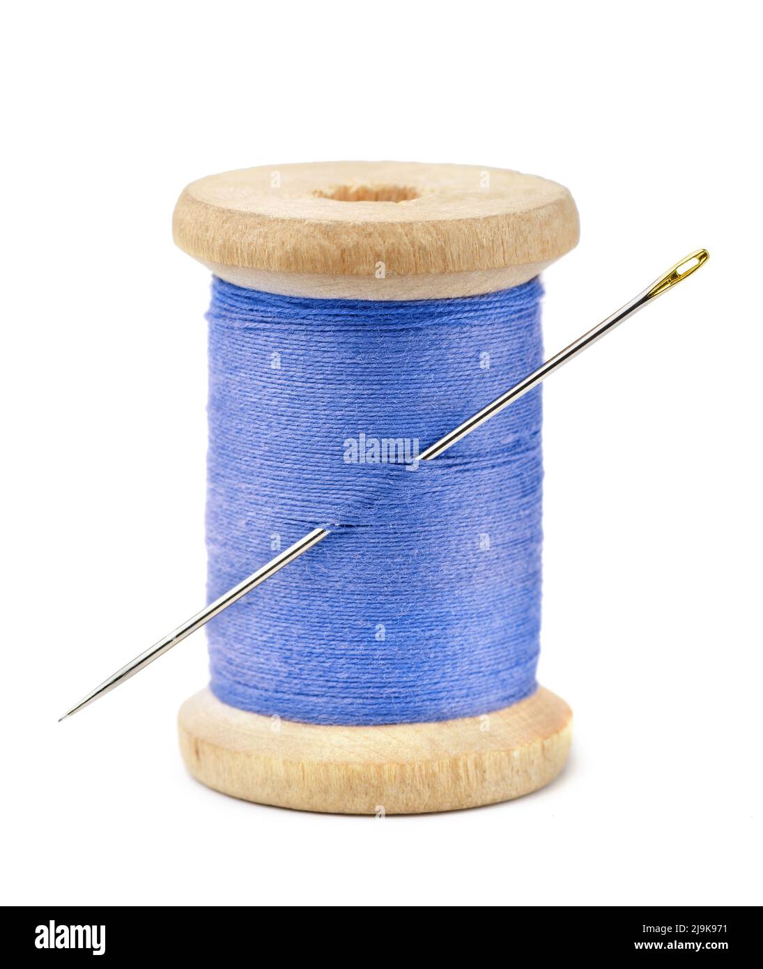 Front view of wood spool of blue thread and needle isolated on white Stock Photo