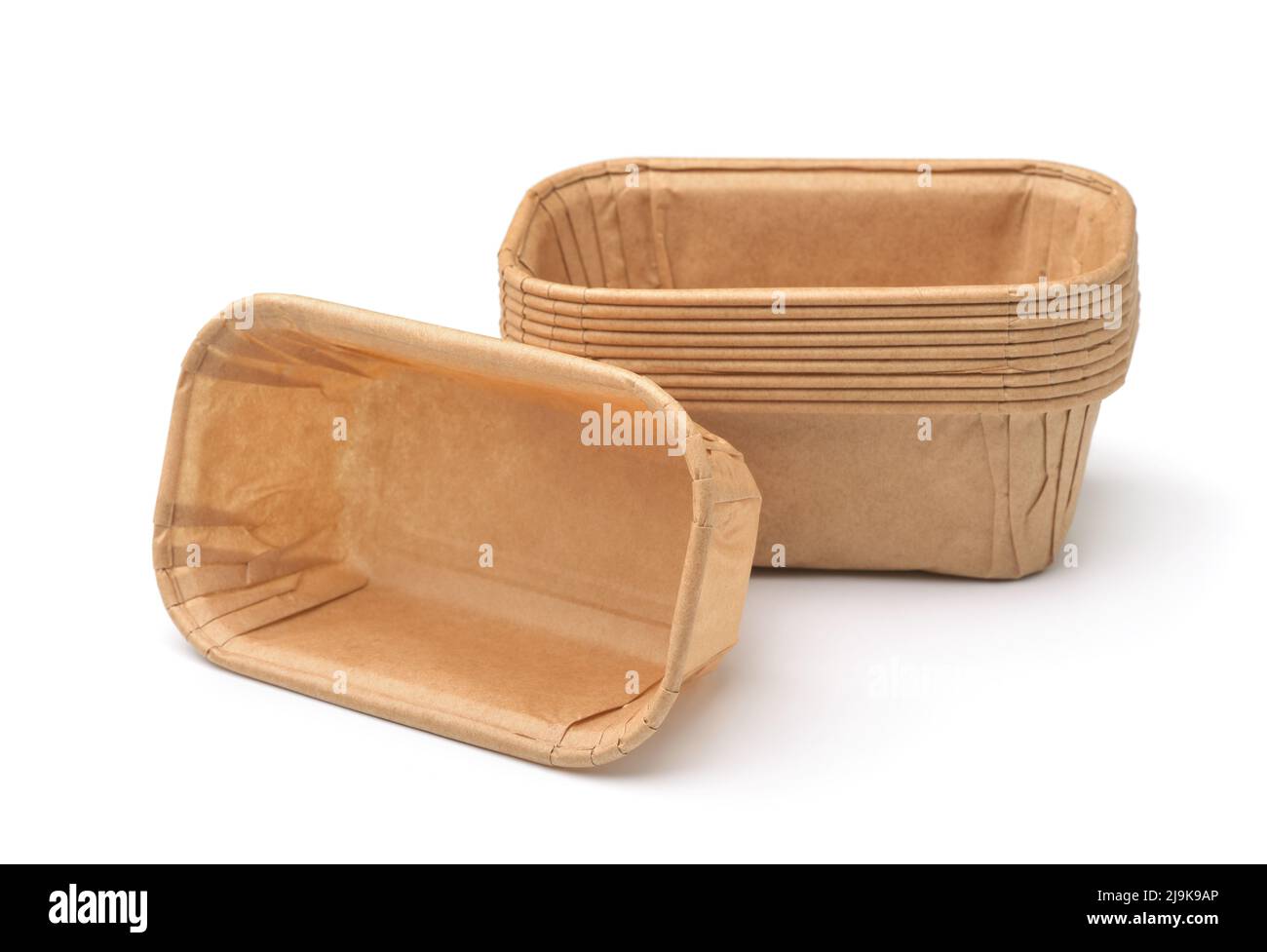 Empty disposable rectangular brown paper baking molds isolated on white