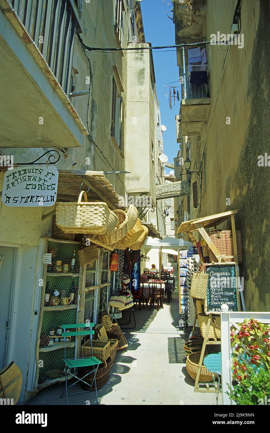 Souvenir shops in a narrow alley, historic old town of Bonifacio, Corse-du-Sud, Corsica, France, Mediterranean Sea, Europe Stock Photo