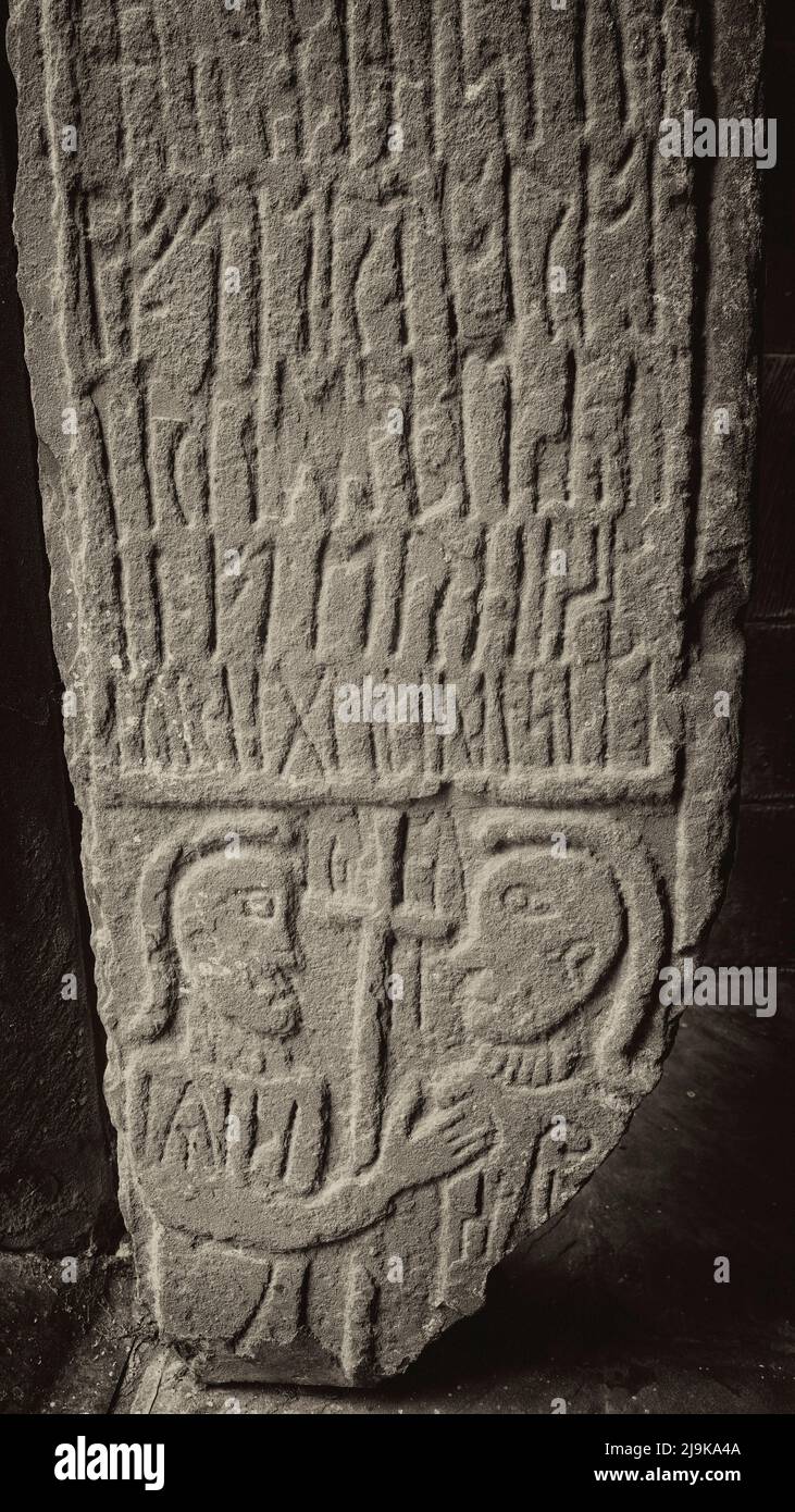 A section of the rune-inscribed Anglo-Saxon cross-shaft found at Urswick in 1911, St Mary's church, Urswick, Cumbria, UK Stock Photo