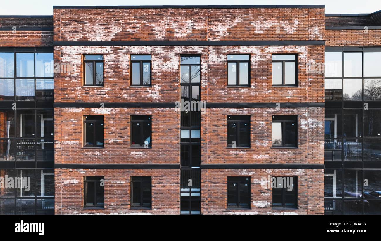 A new brick house stained with white efflorescence, a crystalline of