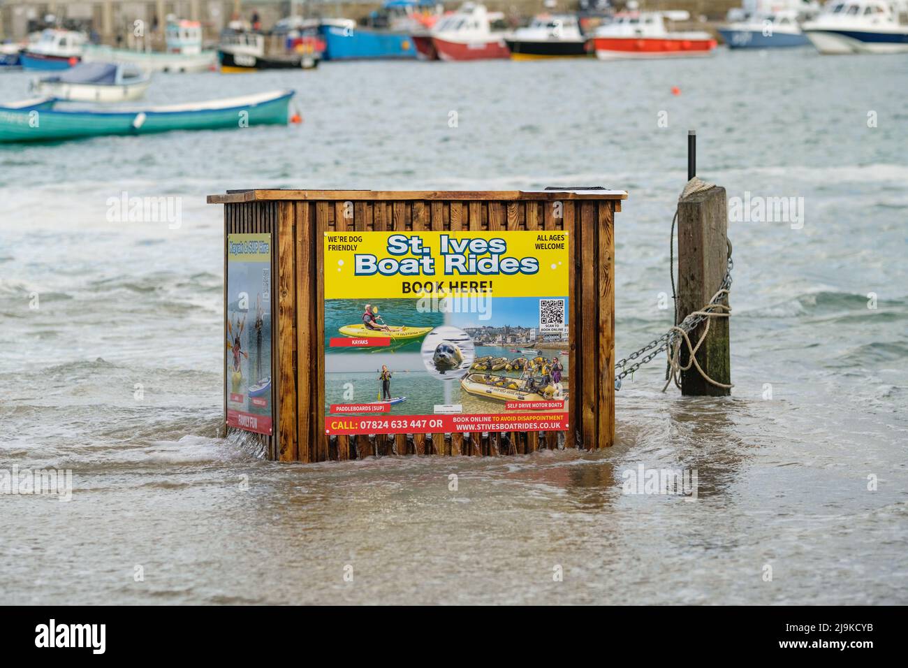 St Ives, Cornwall, UK. Boat Rides Booking Desk at High Tide. Stock Photo