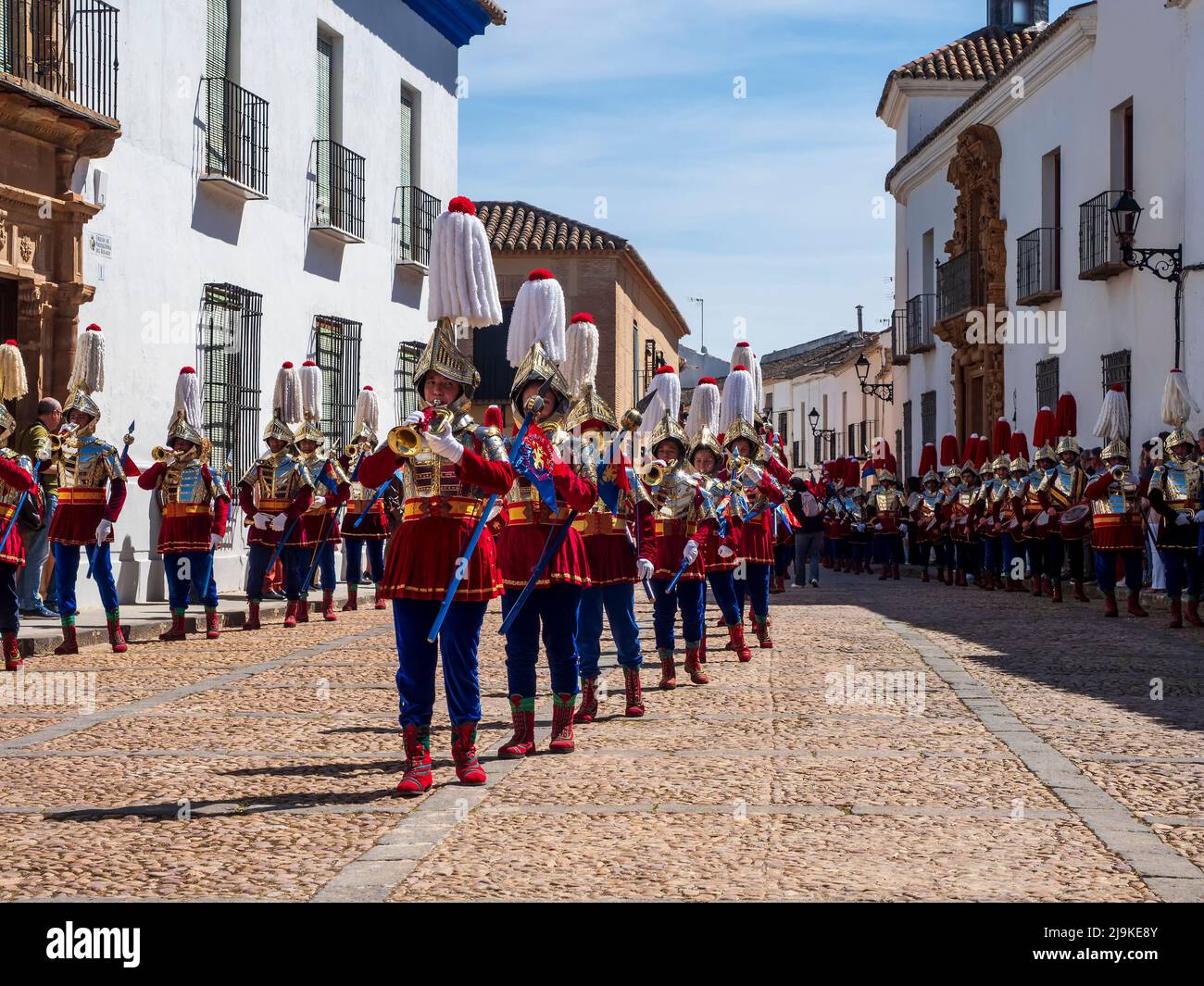 Paso de la Compañía Romana de Almagro with their period costumes and music band in the Easter Sunday parade on Palm Sunday. Stock Photo