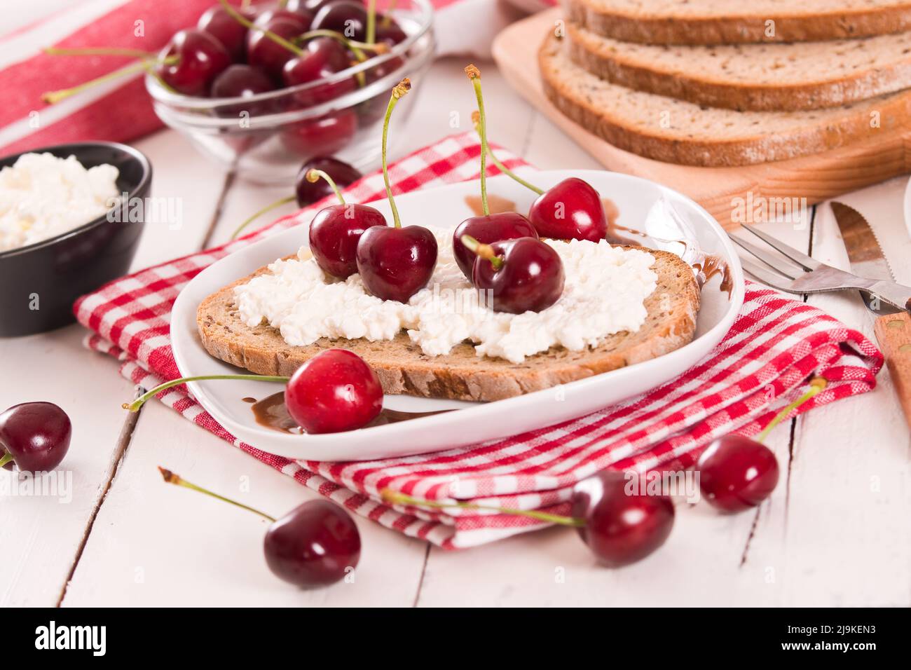 Rye bread with cottage cheese and cherries Stock Photo Alamy