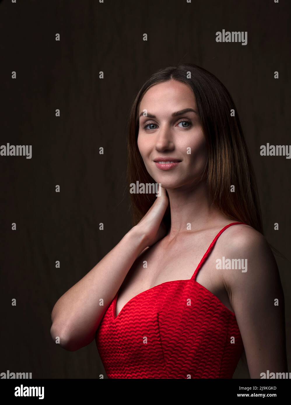 studio portrait on a dark background of a beautiful young woman Stock ...