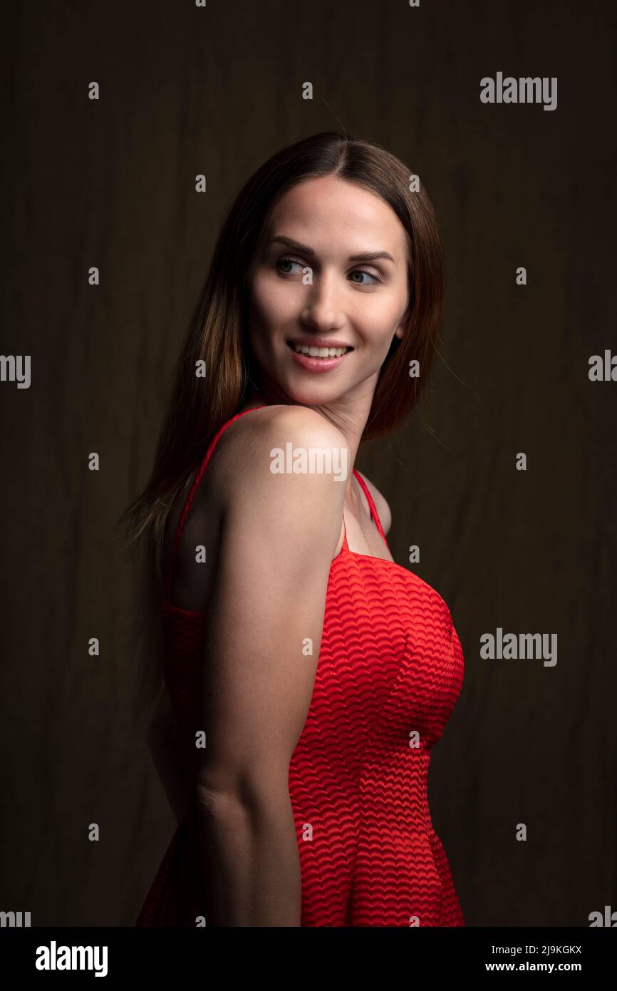 studio portrait on a dark background of a beautiful young woman Stock ...