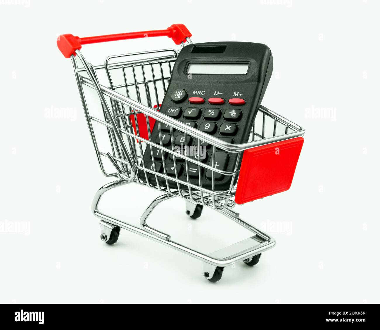 Shopping cart and calculator on white background Stock Photo Alamy