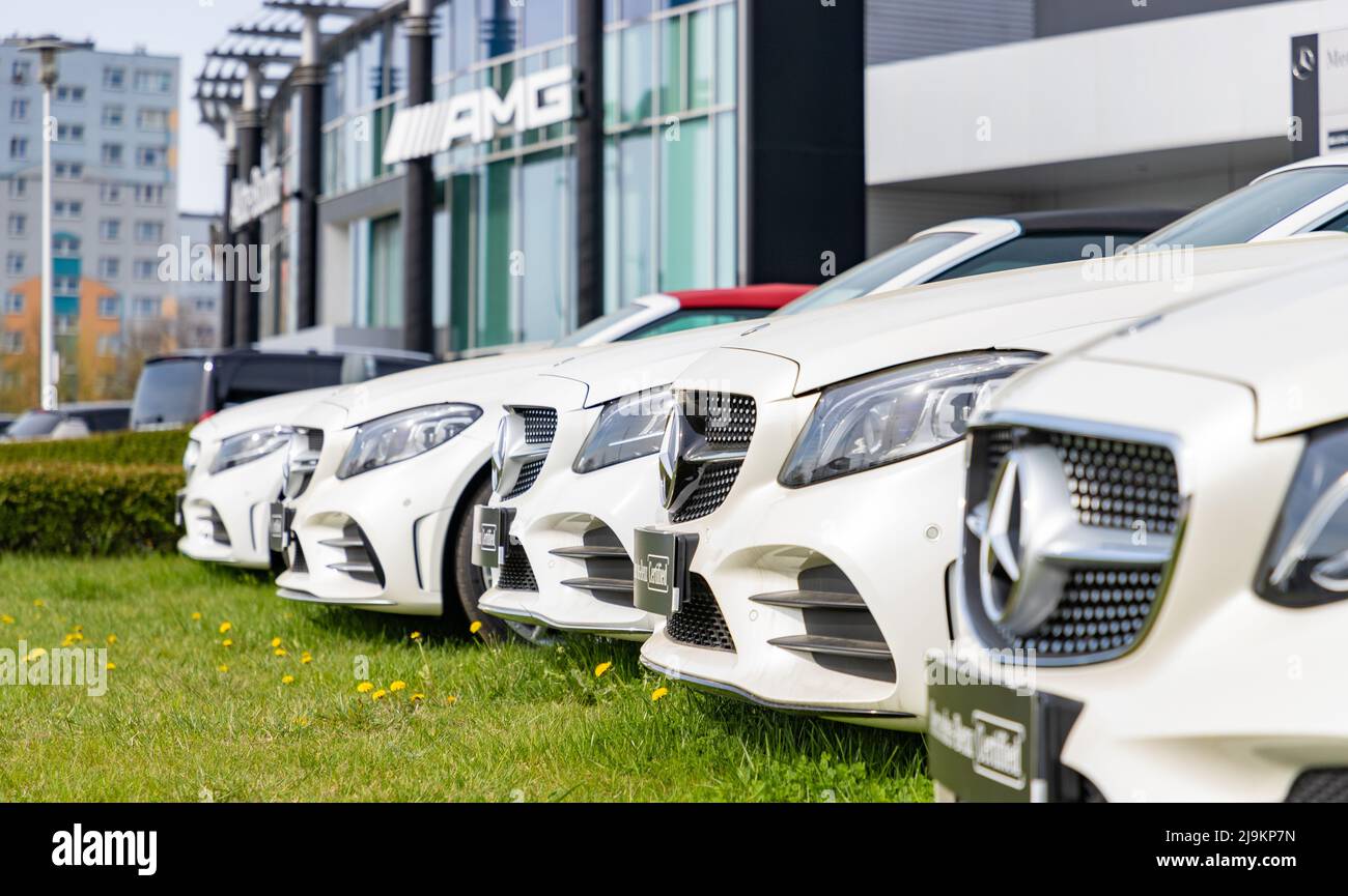 A picture of a row of white vehicles at a Mercedes Benz car dealership, in Poland. Stock Photo
