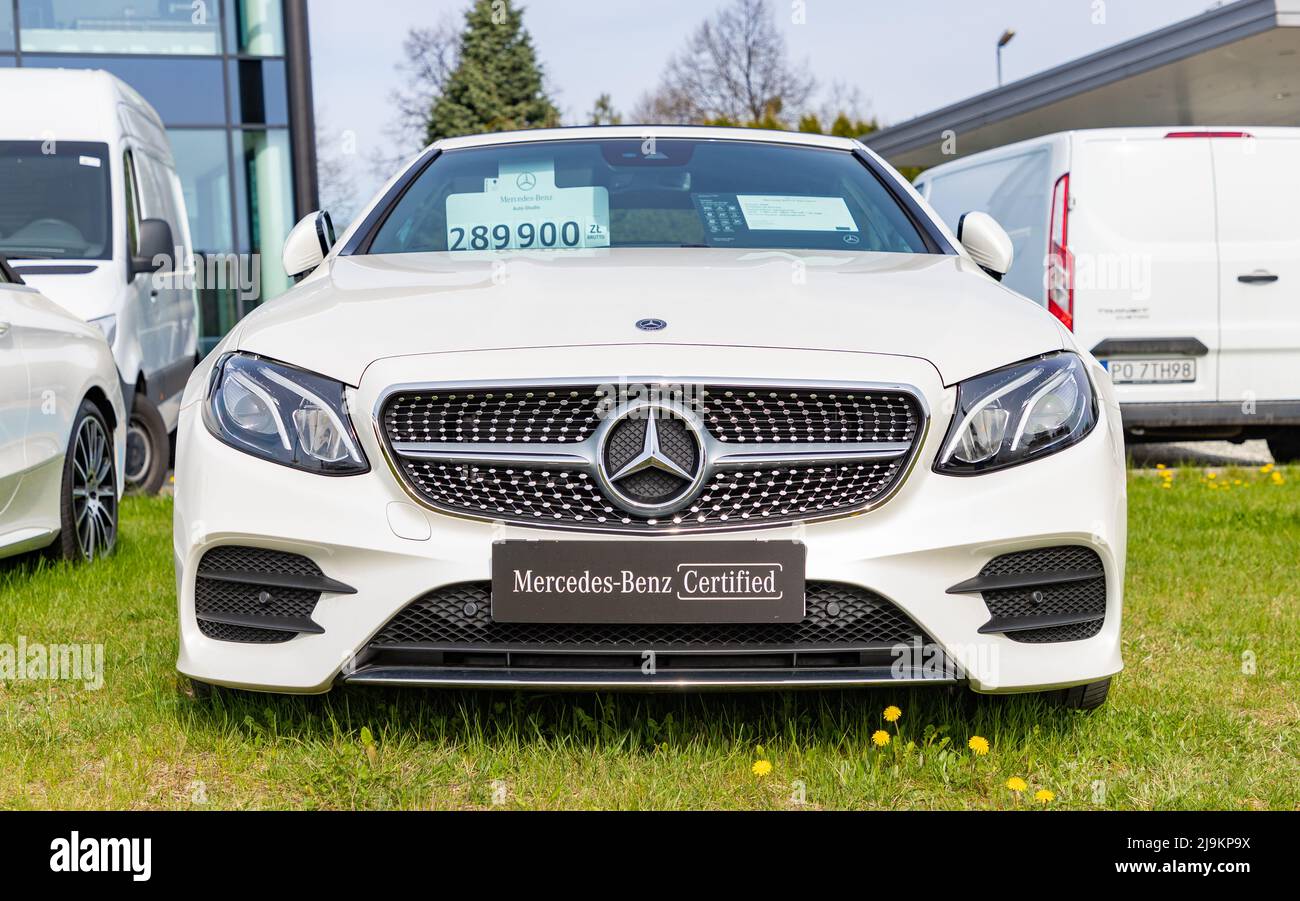 A picture of a white Mercedes Benz Class C Coupé at a car dealership. Stock Photo