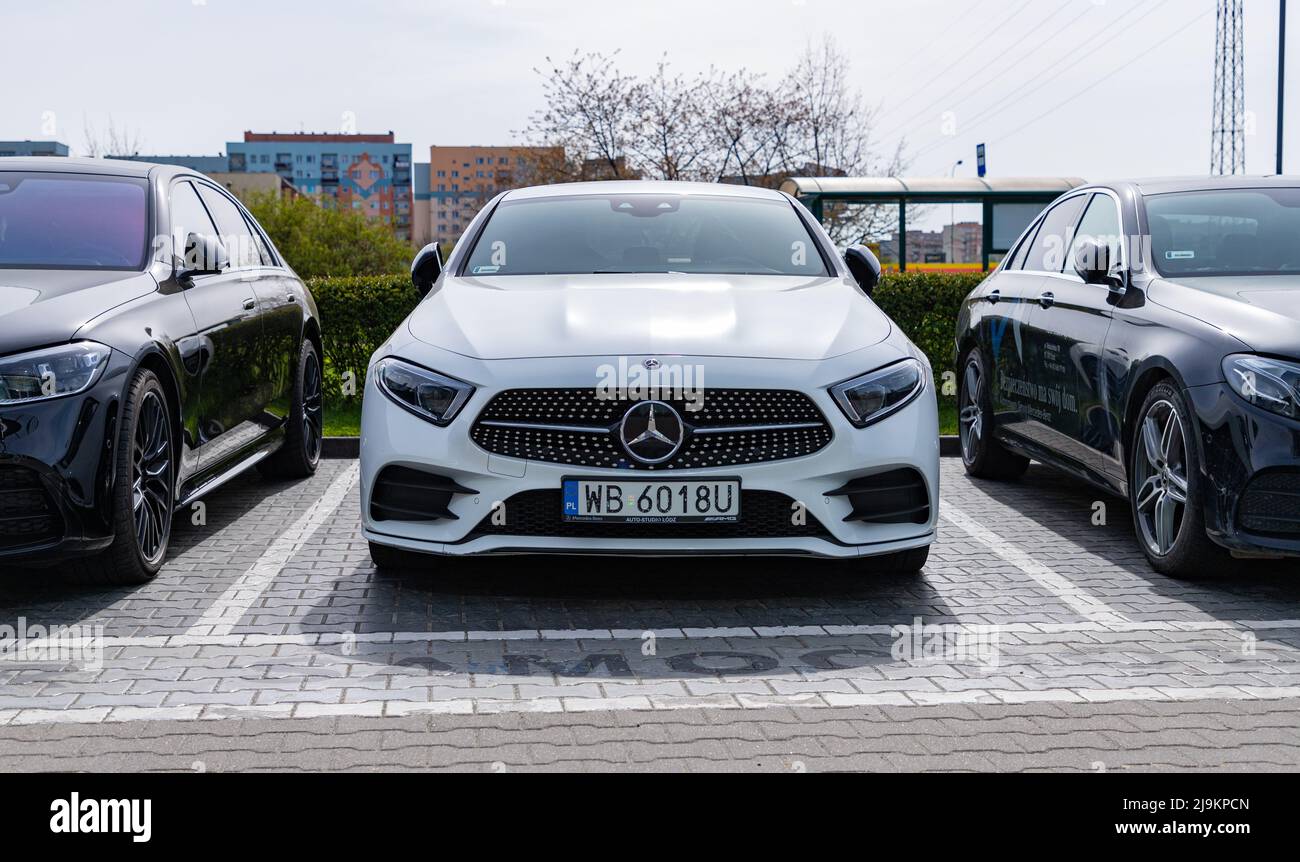 A picture of a white Mercedes Benz Class A Compact at a car dealership. Stock Photo