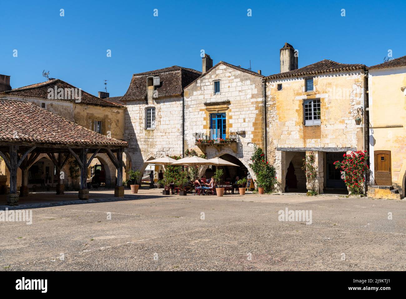 Monpazier, France - 11 May, 2022: view of the Place des Cornieres Square in the historic city center of Monpazier Stock Photo