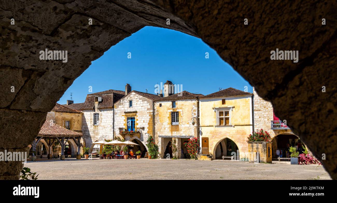 Monpazier, France - 11 May, 2022: view of the Place des Cornieres Square in the historic city center of Monpazier Stock Photo
