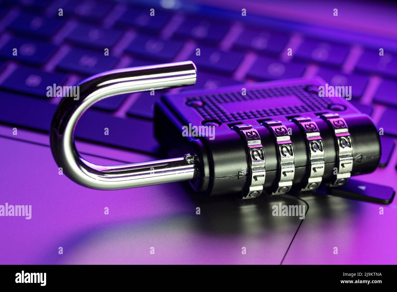 Computer Security Vulnerability concept. Open padlock on laptop with colorful lights Stock Photo