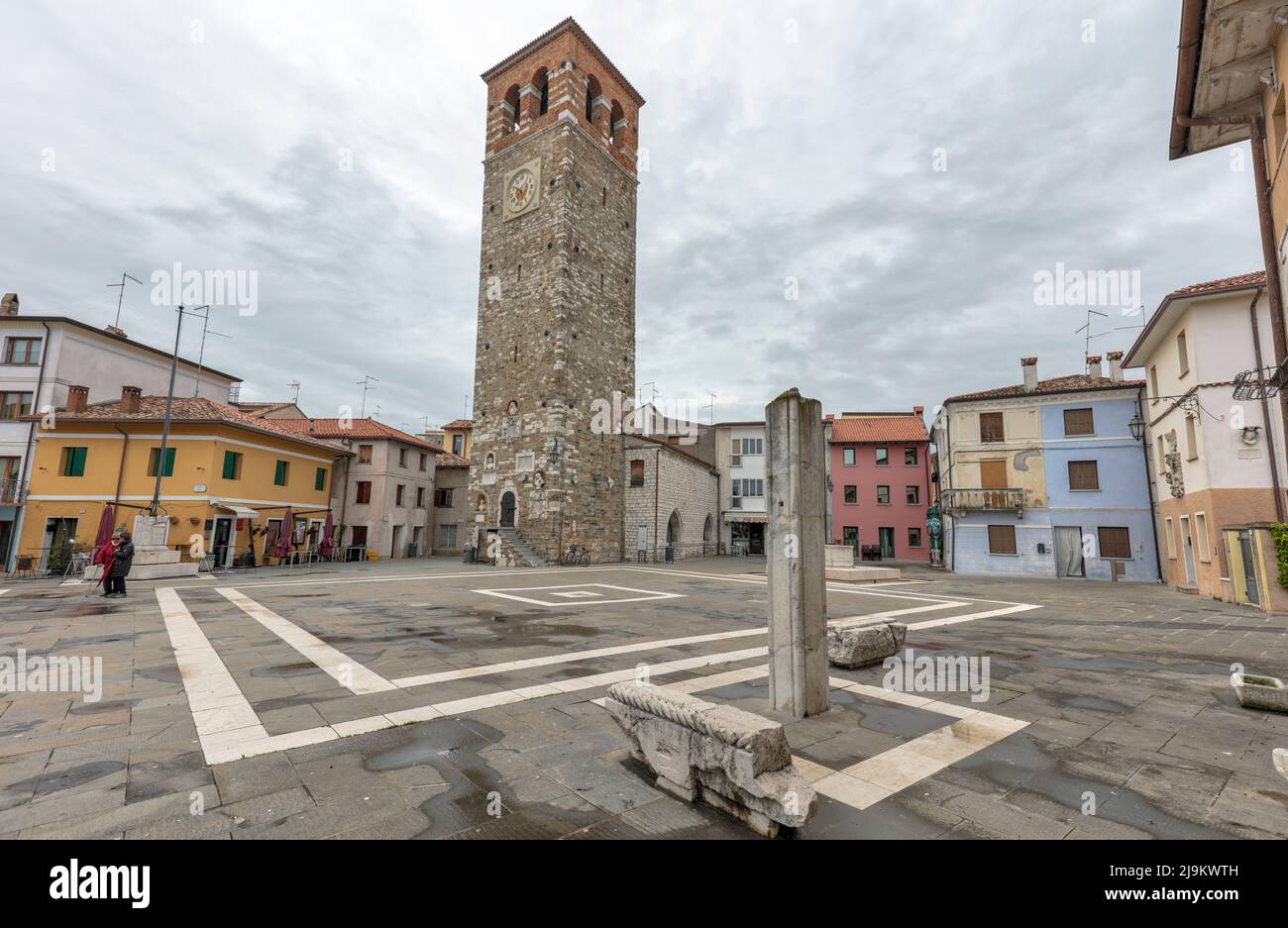 Historic 16th century Torre Millenaria clock tower in Piazza Vittorio Emanuele II in the Adriatic seaside town on the Marano Lagoon Stock Photo