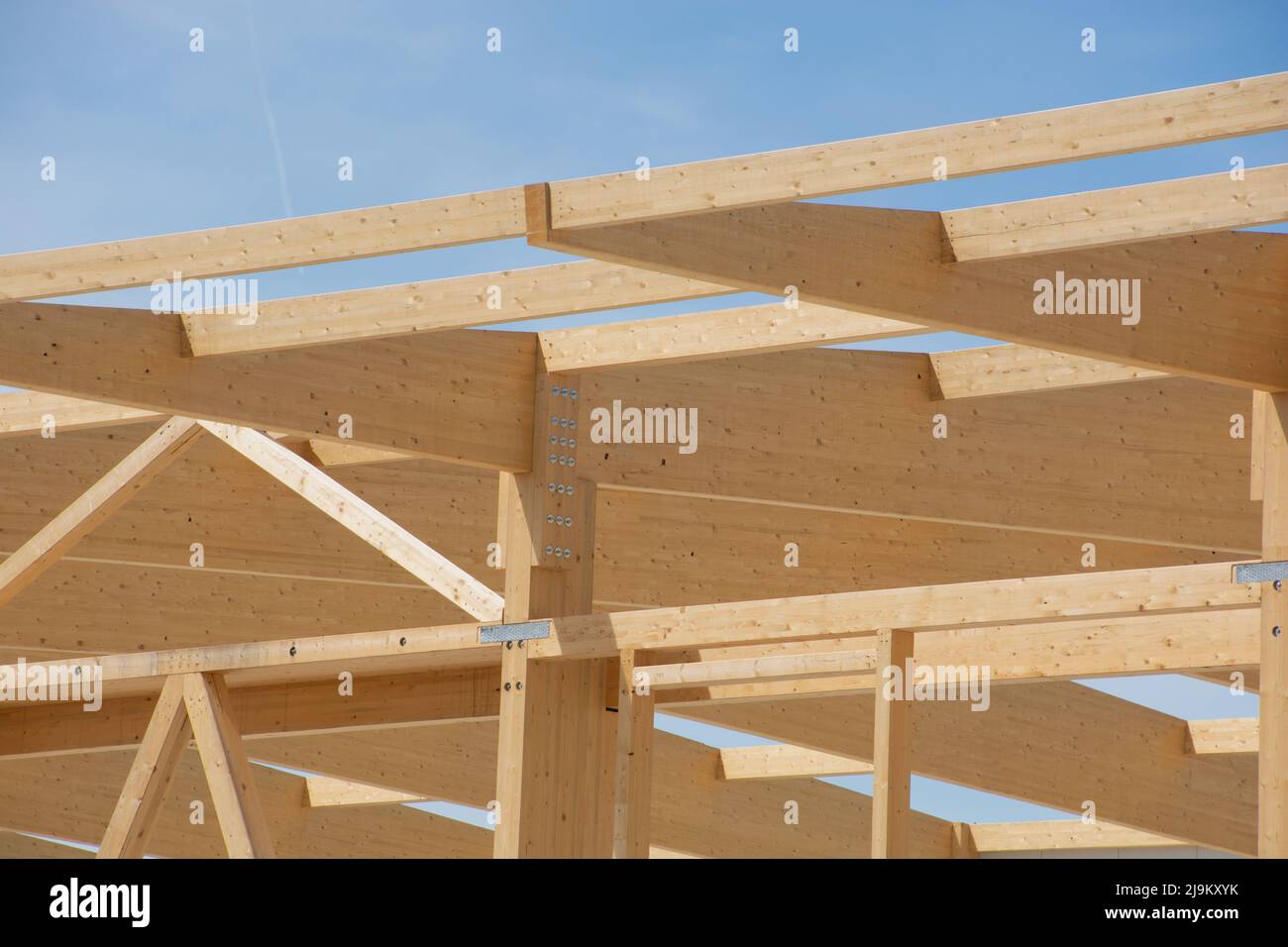 The construction of the wooden roof connected to the individual beams Stock Photo