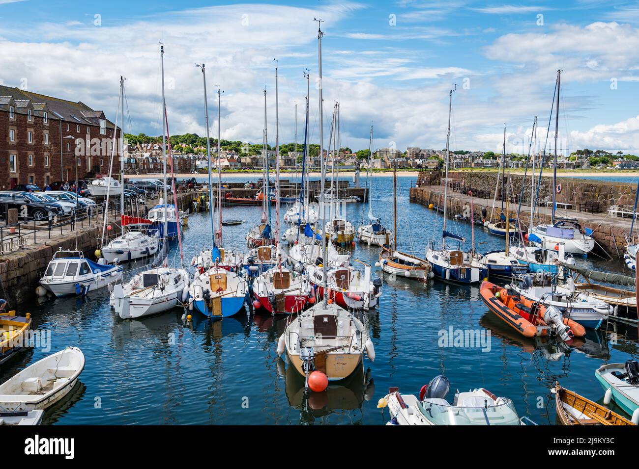 North Berwick, East Lothian, Scotland, United Kingdom, 24th May 2022. UK Weather: warm sunshine in the coastal town on a sunny day with boats in the small harbour Stock Photo